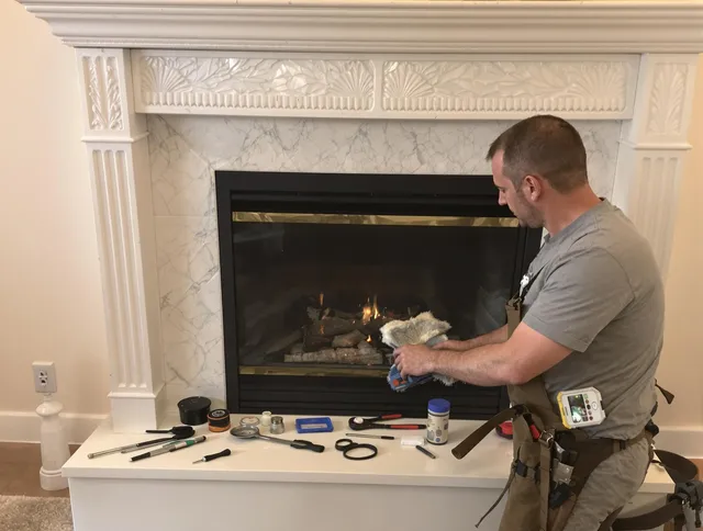 Bridgeport Chimney Sweep performing fireplace maintenance in Bridgeport, CT